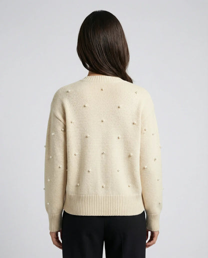 Cream cardigan by Ilynora, back view with soft knit texture and relaxed silhouette