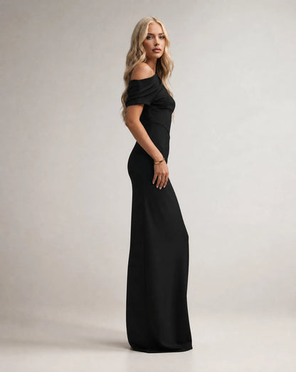 Black one shoulder maxi dress for women by Ilynora, side view highlighting the sleek fit and flowing design