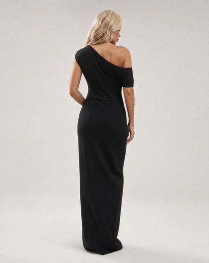 Black one shoulder maxi dress for women by Ilynora, back view showcasing the elegant drape and modern silhouette