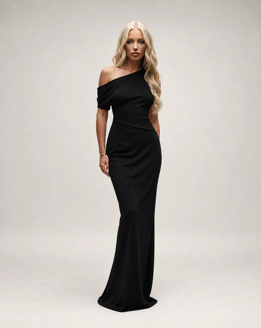 Black one shoulder maxi dress for women by Ilynora, front view with elegant silhouette and asymmetrical neckline