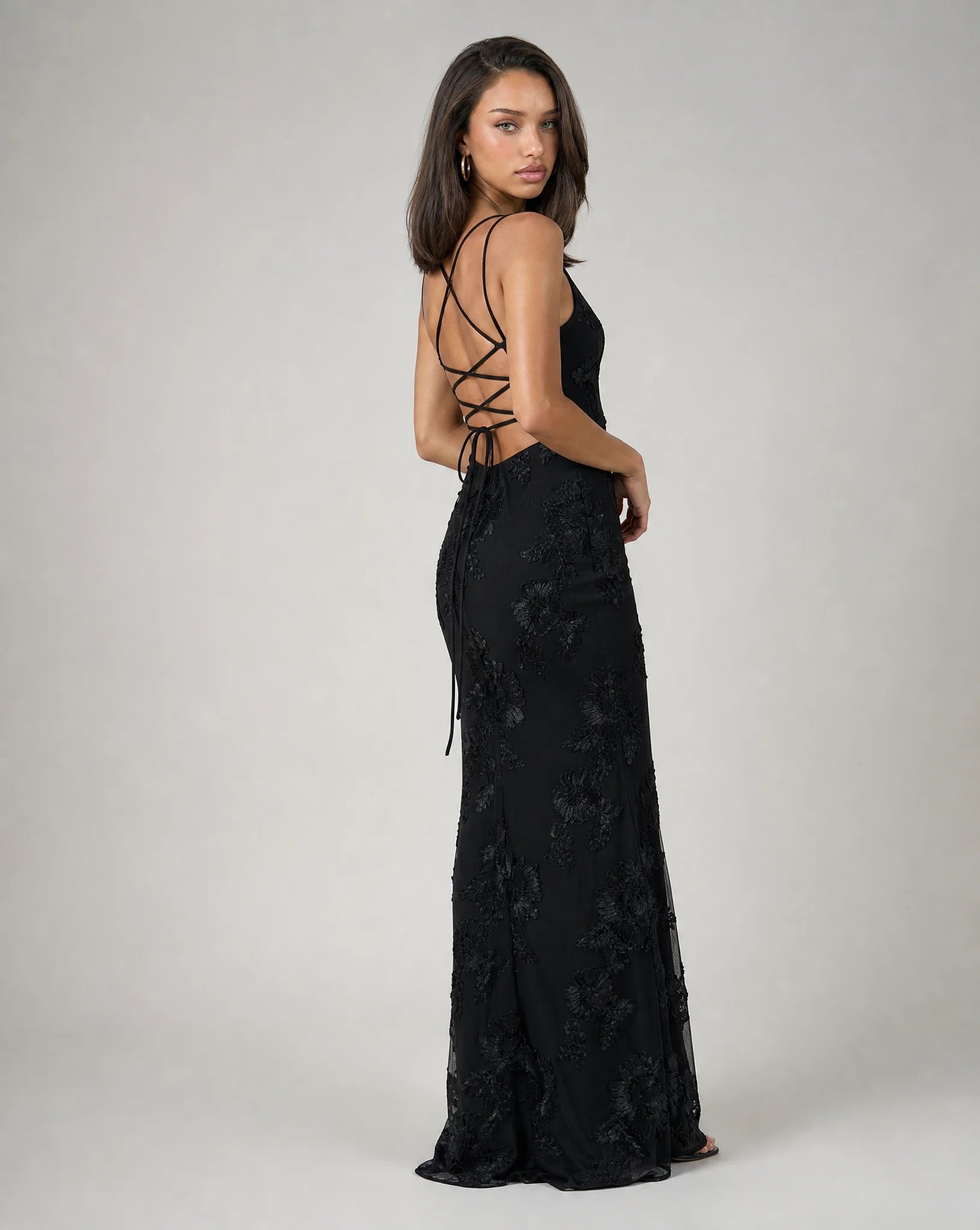 Black open back lace maxi dress for women by Ilynora, back view showcasing the elegant open back design