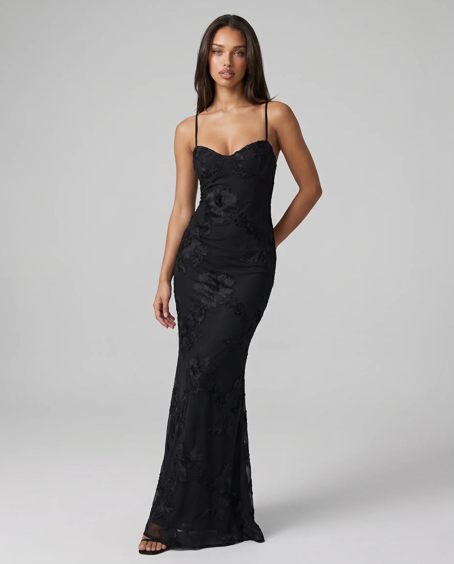 Black open back lace maxi dress for women by Ilynora, front view with elegant silhouette and delicate lace