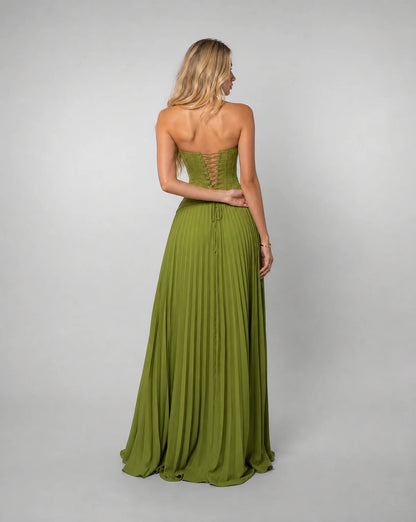 Green pleated corset maxi dress for women by Ilynora, back view showcasing the lace up detail and pleated skirt