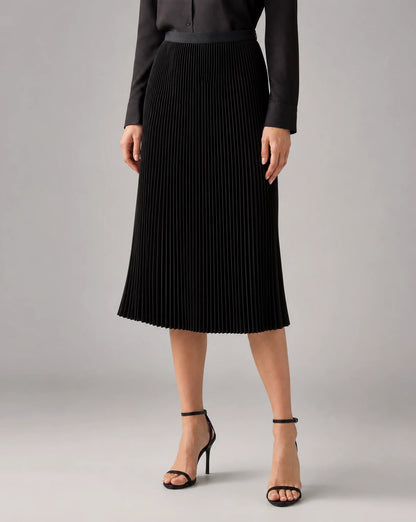Black pleated midi skirt for women by Ilynora, front view with timeless design and flowing silhouette