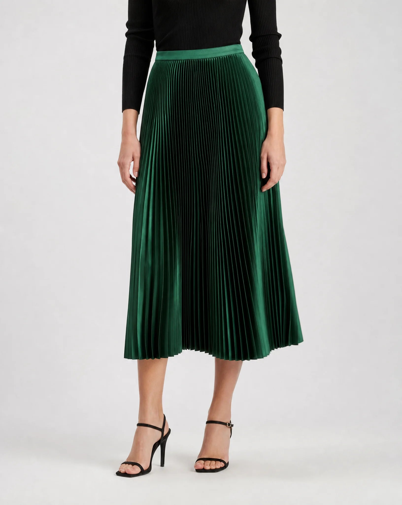 Green pleated midi skirt for women by Ilynora, front view with flowing silhouette and elegant pleats