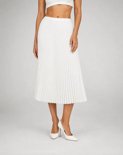White pleated midi skirt for women by Ilynora, front view with flowing shape and timeless elegance