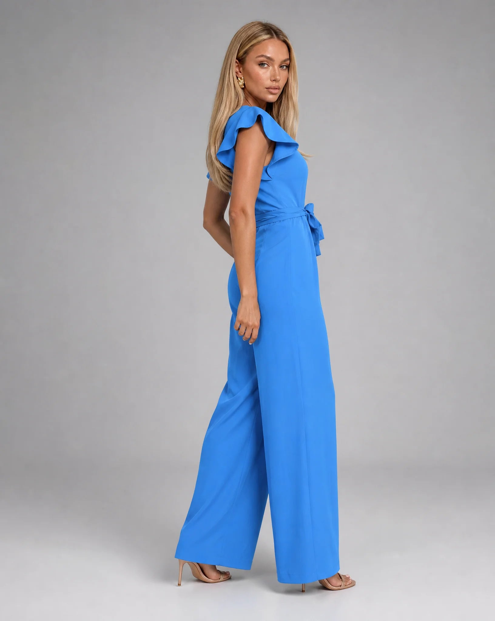 Blue ruffle sleeve jumpsuit for women by Ilynora, back view highlighting the tailored silhouette and soft drape