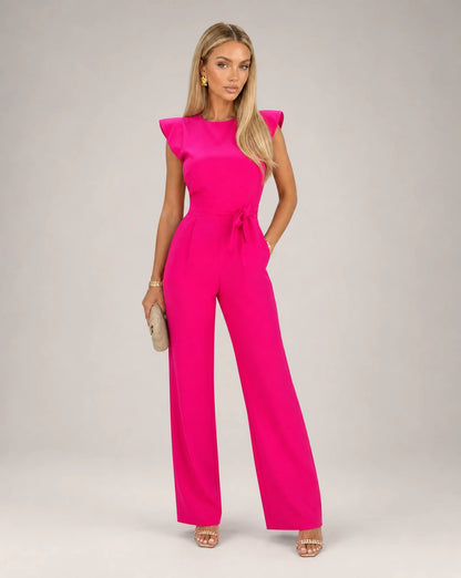 Pink ruffle sleeve jumpsuit for women by Ilynora, front view with belted waist and elegant wide leg fit