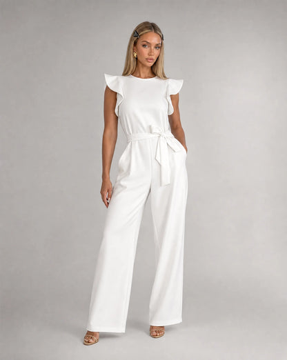 White ruffle sleeve jumpsuit for women by Ilynora, front view with belted waist and flowing silhouette