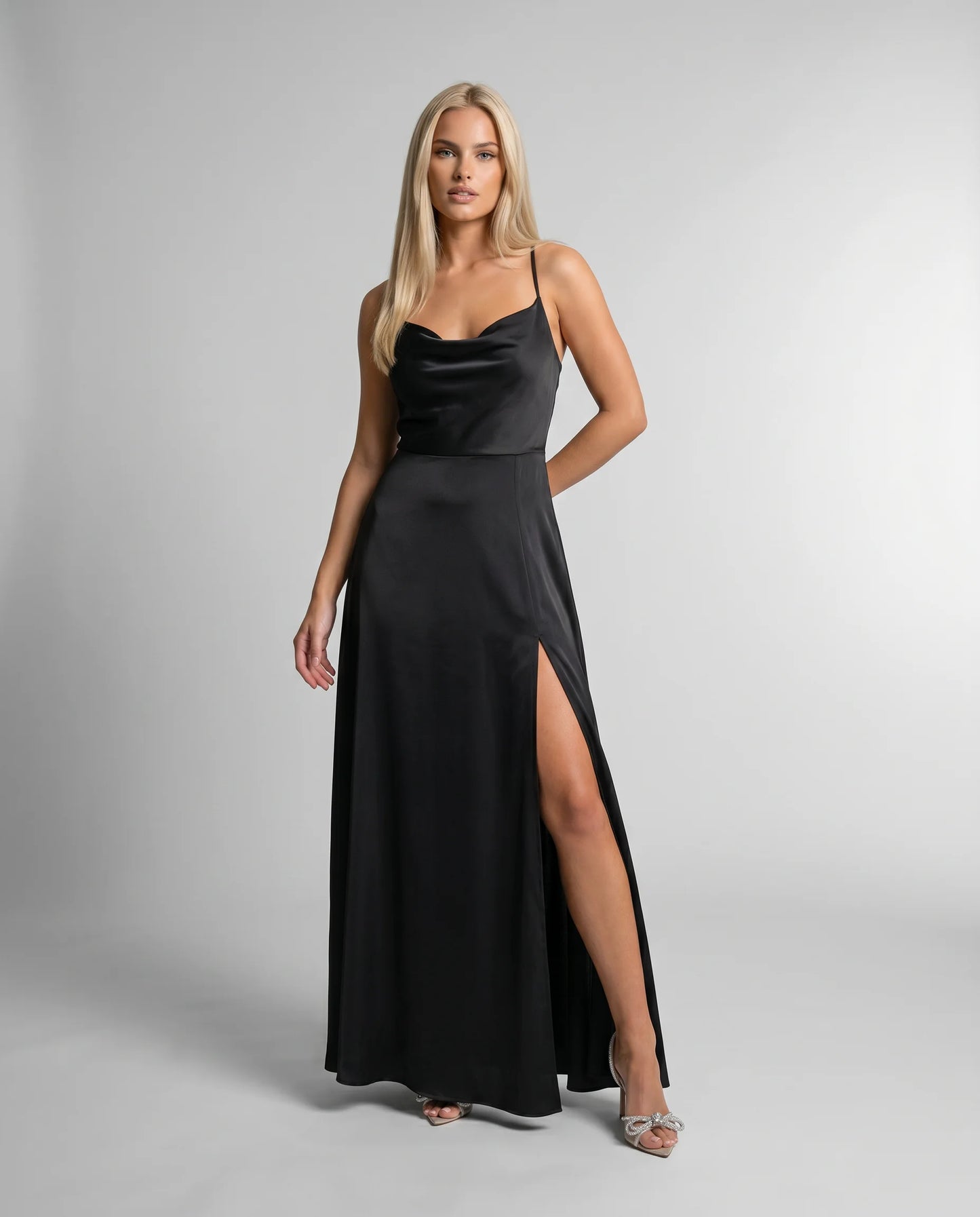 Black satin cowl neck maxi dress for women by Ilynora, front view with refined draping and side slit