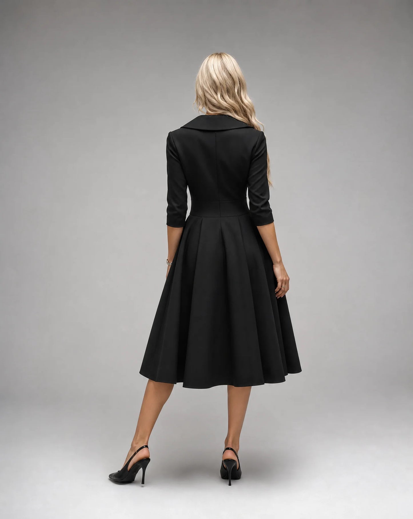Black satin lapel midi dress for women by Ilynora, back view showcasing the flowing skirt and refined fit