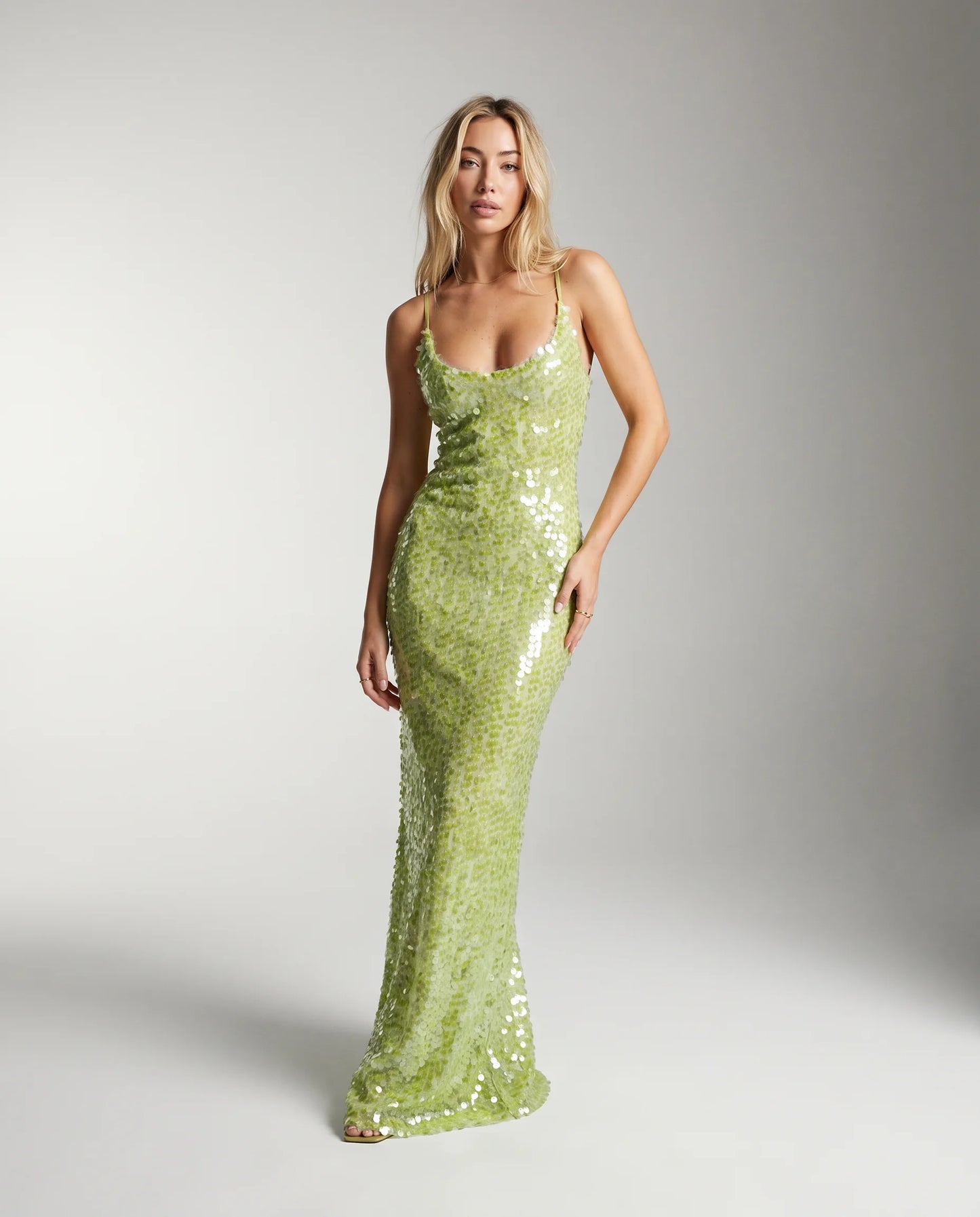 Green sequin backless maxi dress for women by Ilynora, front view with shimmering finish and elegant silhouette