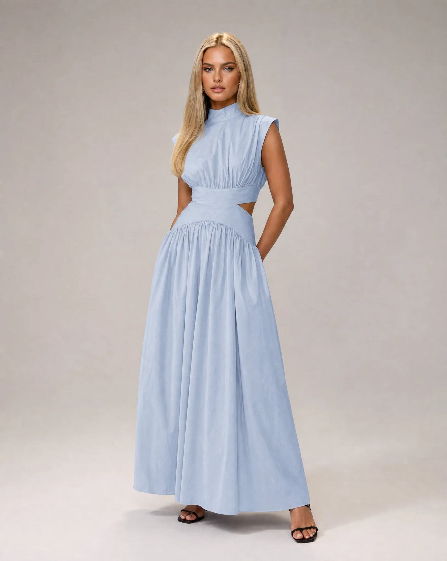 Turquoise sleeveless cut out maxi dress for women by Ilynora, front view with elegant drape and flowing fit