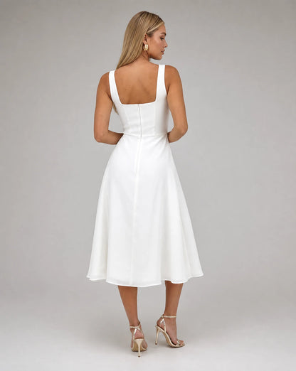 White square neck midi dress for women by Ilynora, angled view highlighting the elegant neckline and flowing fit