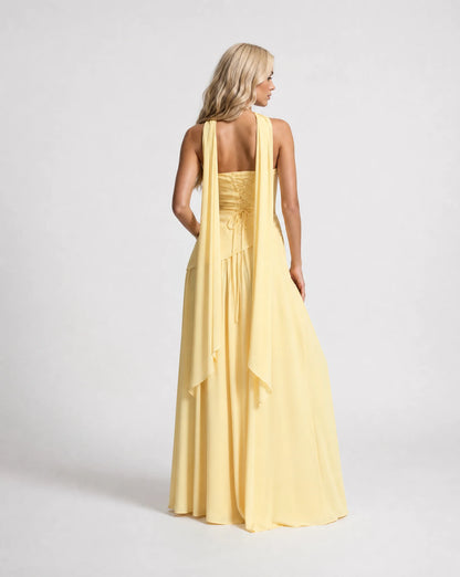 Yellow strapless maxi dress for women by Ilynora, back view showcasing the elegant drape and scarf detail