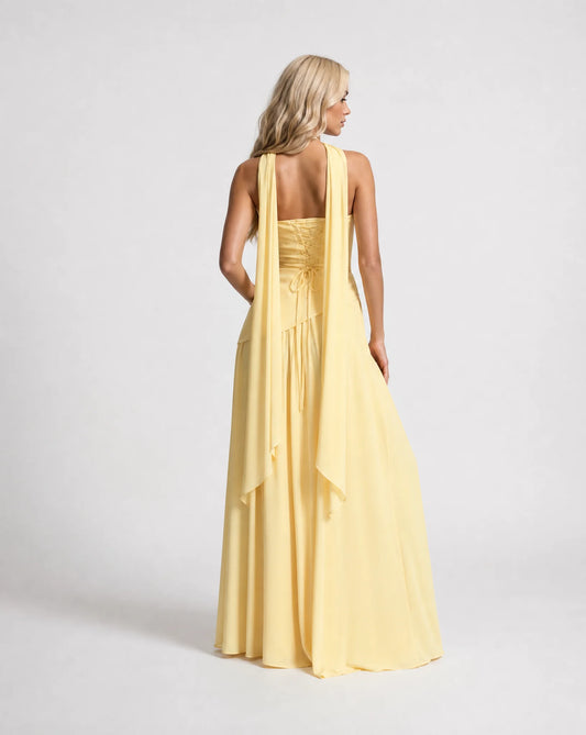Yellow strapless maxi dress for women by Ilynora, back view showcasing the elegant drape and scarf detail