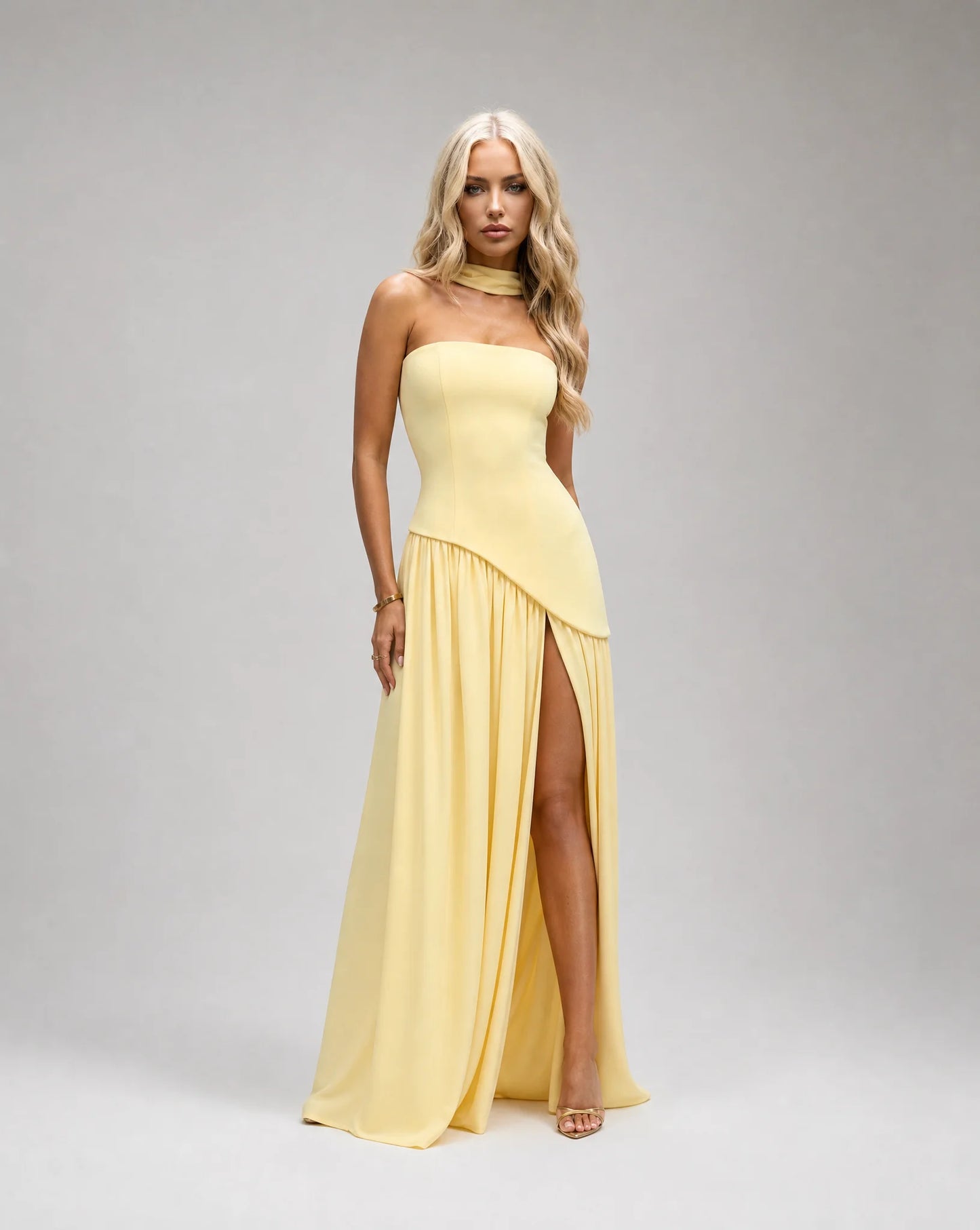 Yellow strapless maxi dress for women by Ilynora, front view with scarf detail and flowing silhouette