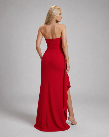 Red strapless ruched maxi dress for women by Ilynora, back view highlighting the flowing silhouette and open back