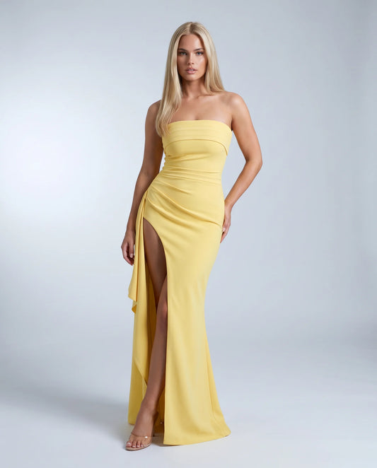 Yellow strapless ruched maxi dress for women by Ilynora, front view with elegant silhouette and thigh high split