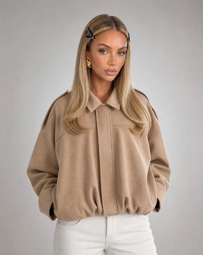 Beige suede bomber jacket for women by Ilynora, front view with relaxed silhouette and classic design
