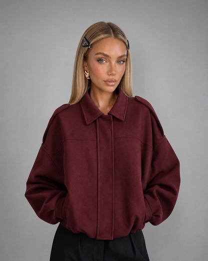 Burgundy suede bomber jacket for women by Ilynora, front view with soft texture and relaxed silhouette