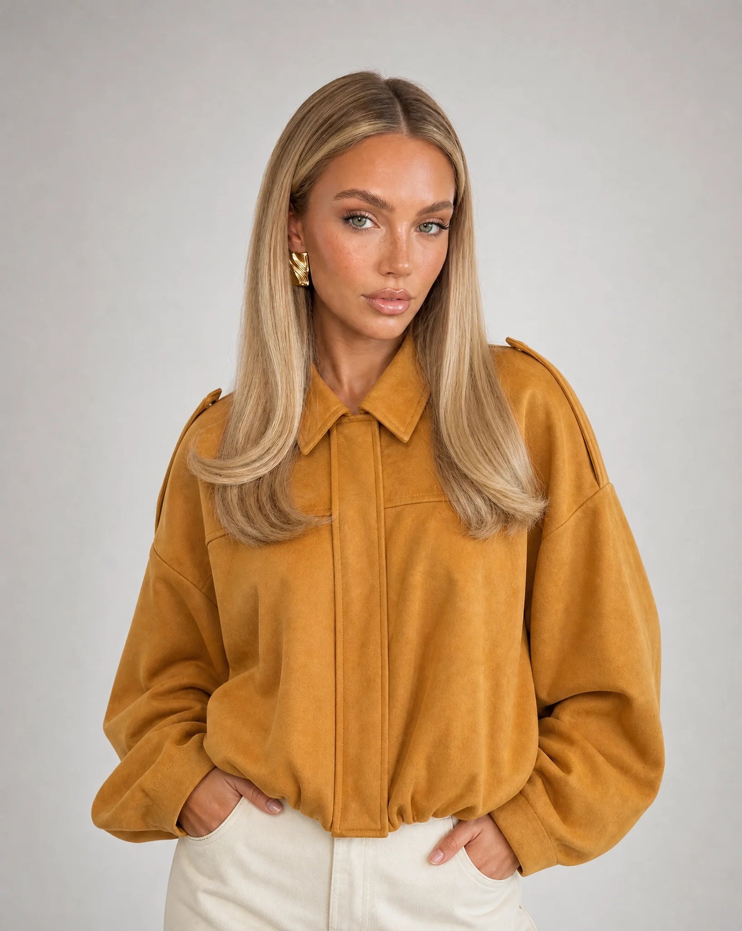 Orange suede bomber jacket for women by Ilynora, front view with oversized fit and modern appeal