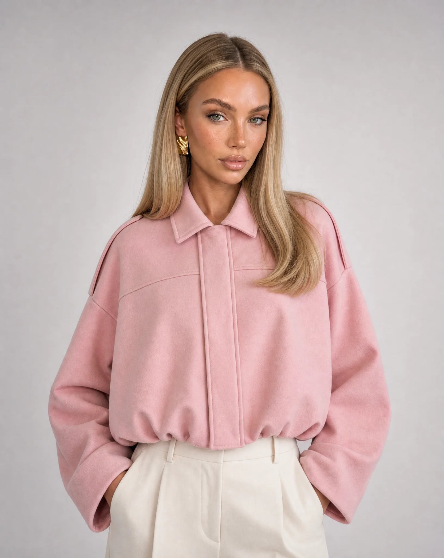 Pink suede bomber jacket for women by Ilynora, front view with relaxed fit and soft texture