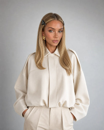 White suede bomber jacket for women by Ilynora, front view with oversized silhouette and clean design