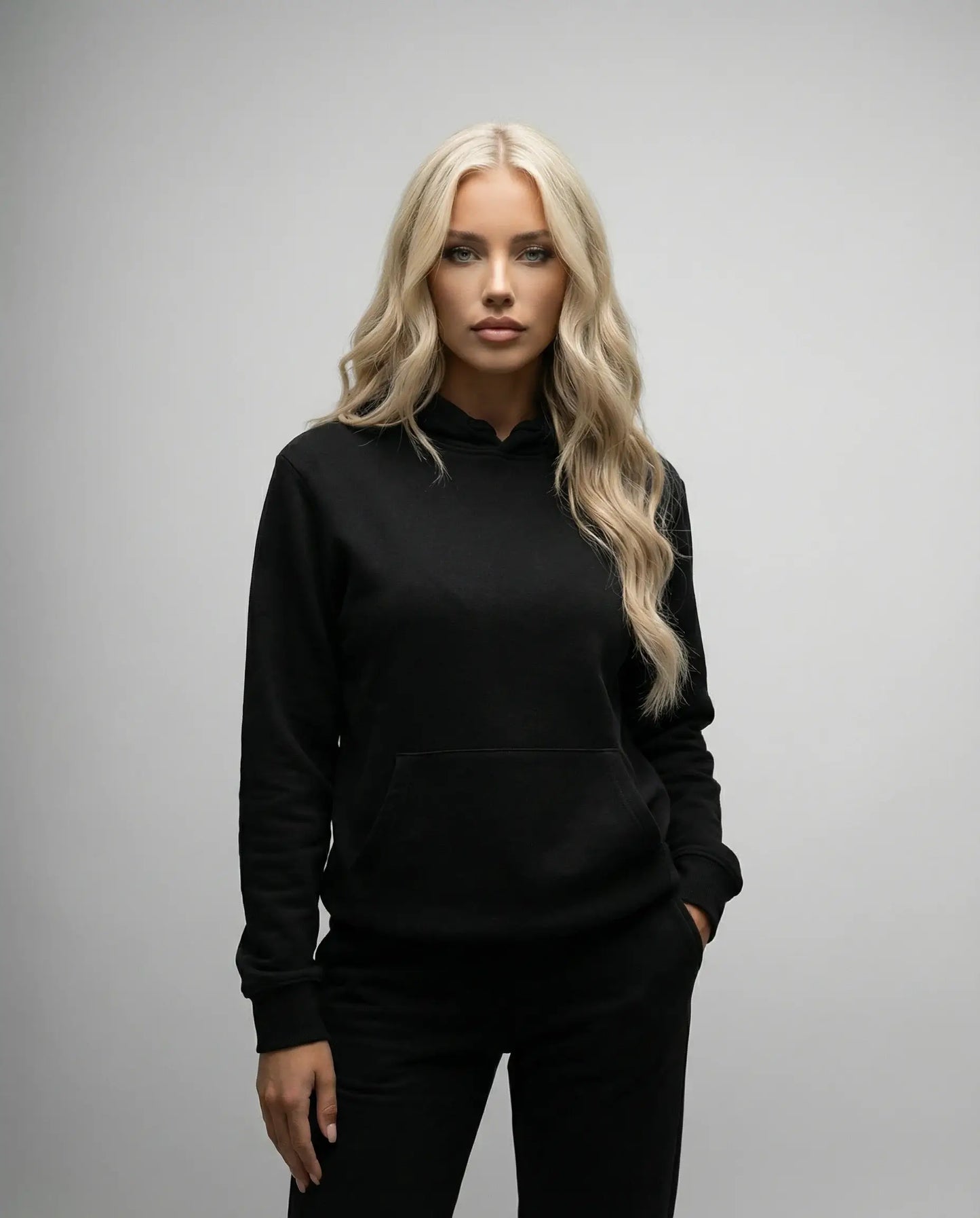 Black unisex hoodie by Ilynora, front view with classic silhouette and adjustable hood