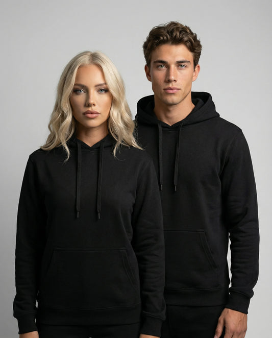 Black unisex hoodie by Ilynora on male and female models, front view with clean minimal design and relaxed fit
