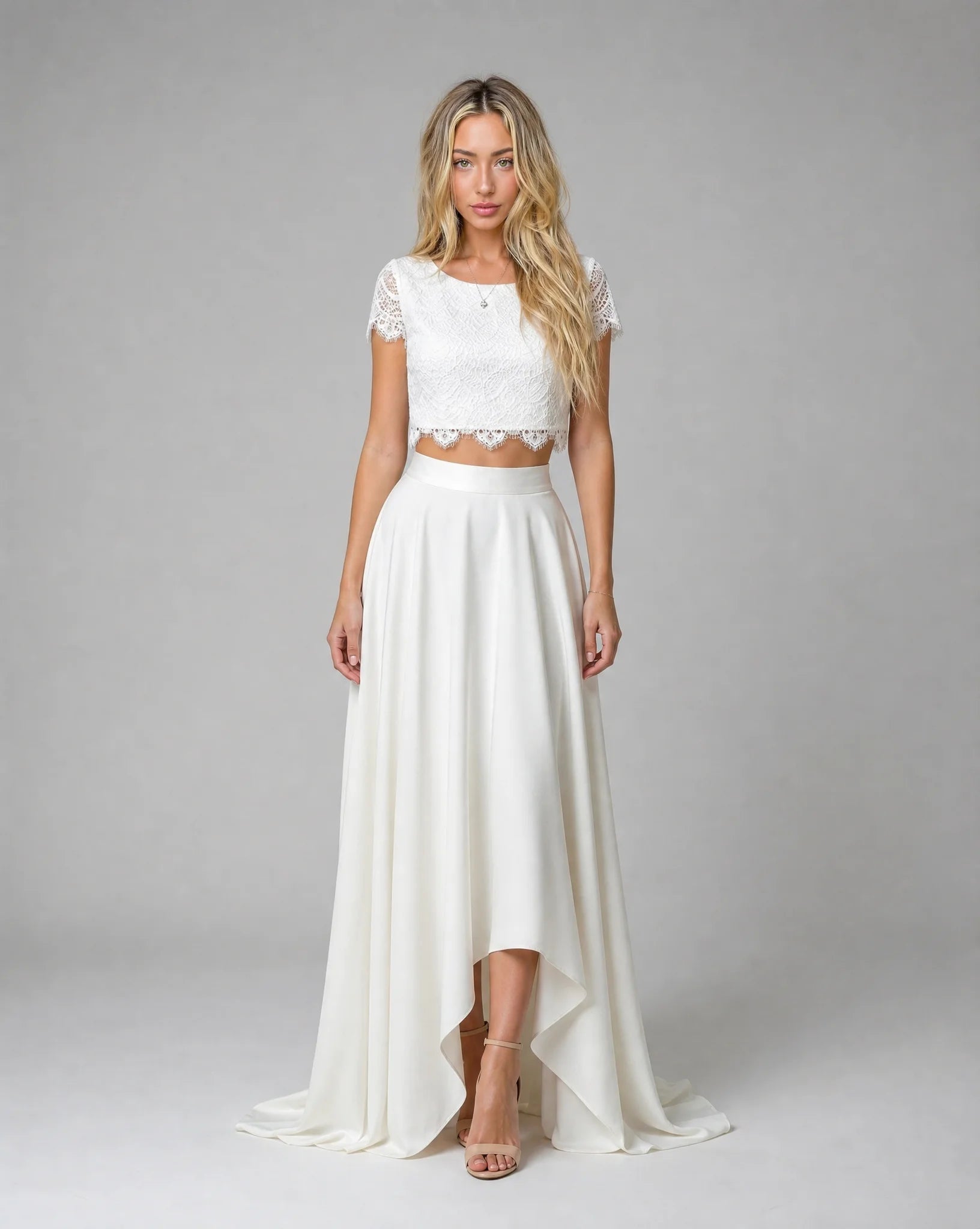 Women's white bohemian lace high low wedding dress with two-piece design, floral lace details and flowing bridal silhouette by ILYNORA