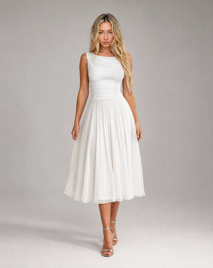 Women's white draped cowl neck pleated midi dress featuring a flowing pleated skirt, flattering silhouette and elegant occasion wear by ILYNORA