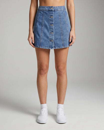 Blue denim A-line mini skirt with button front design and high waist fit for everyday styling by ILYNORA