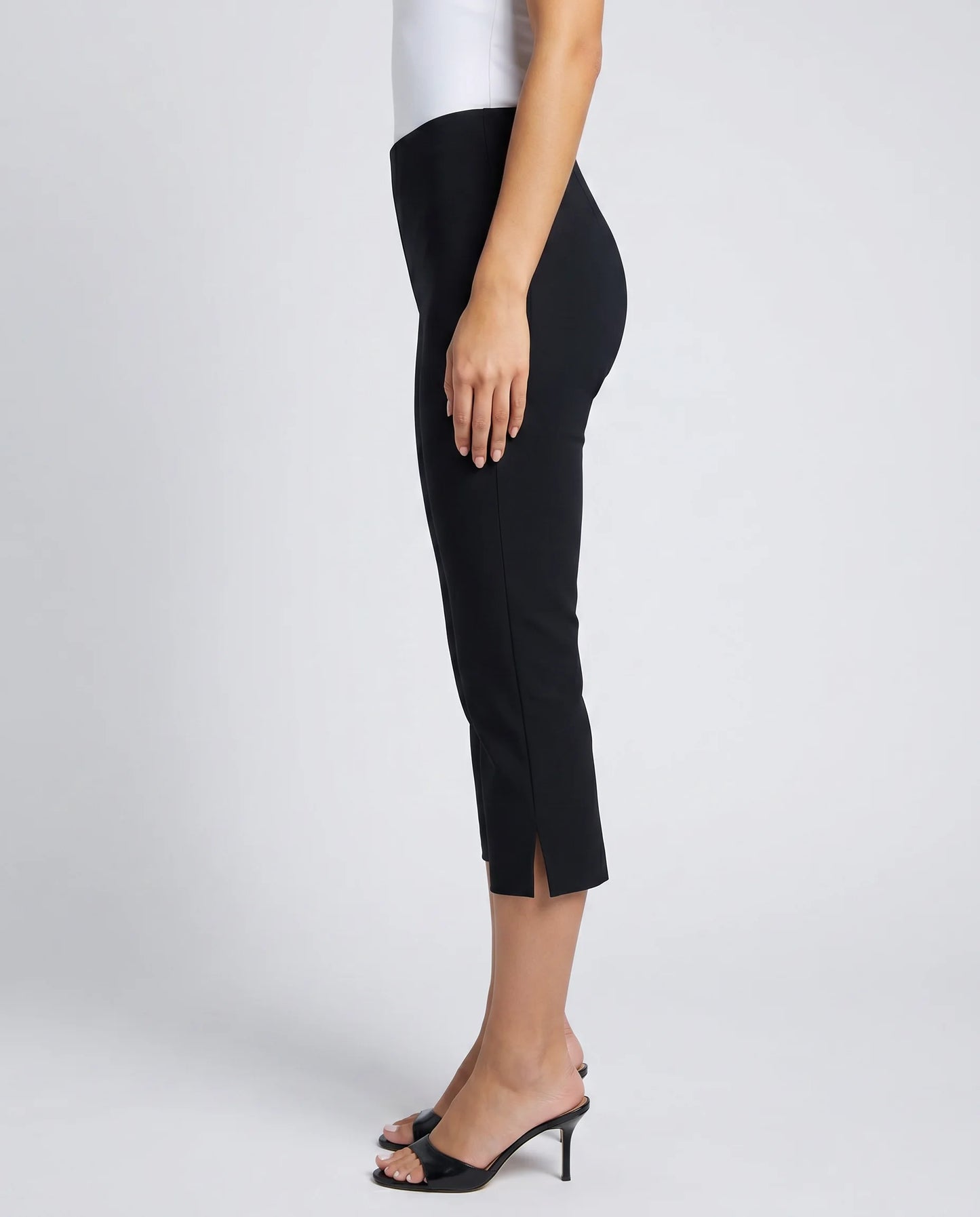 Women's black cropped capri trousers with elegant slim fit and side split detail by ILYNORA