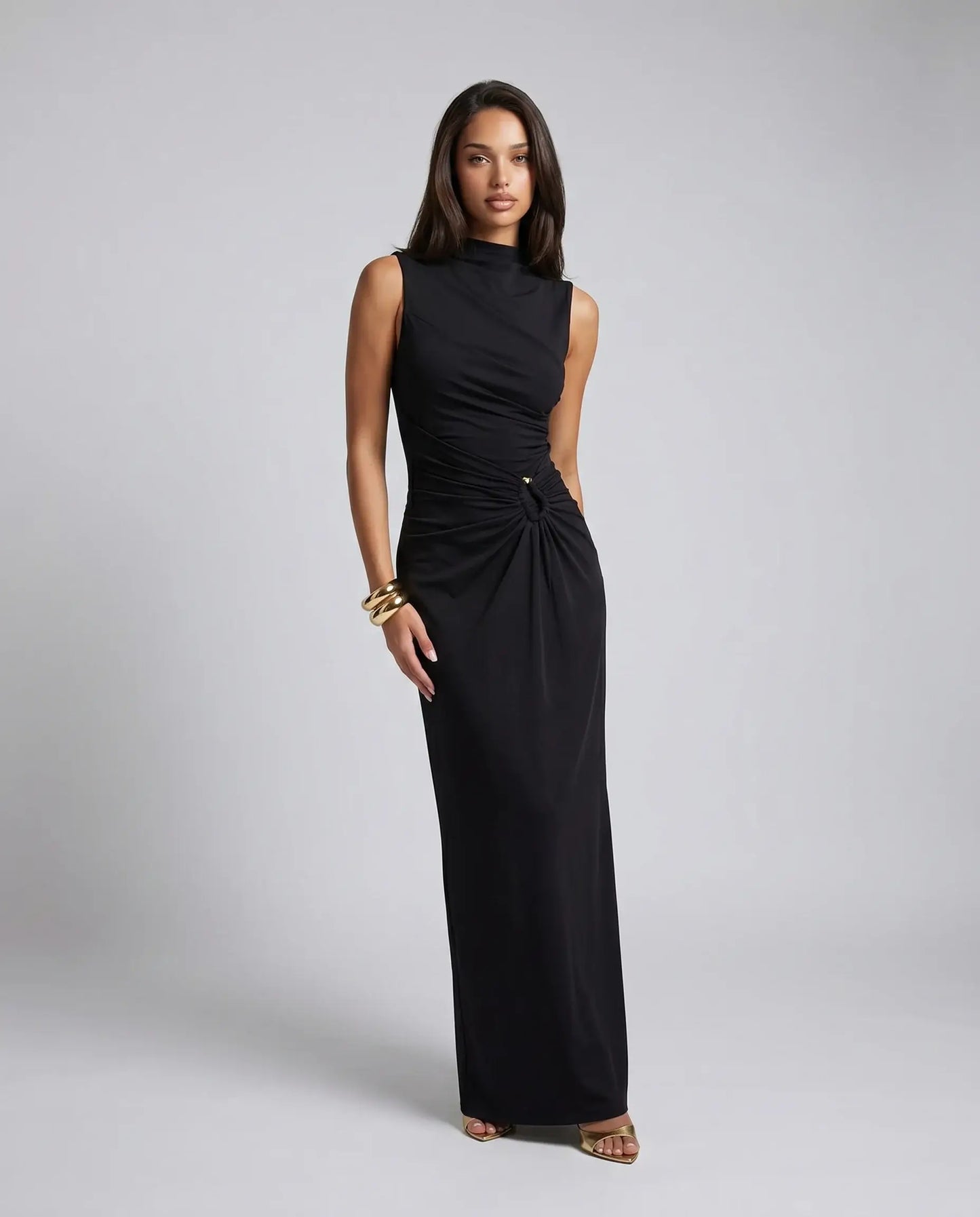 Black high neck ruched maxi dress for women by Ilynora, angled view showcasing elegant draping and refined fit