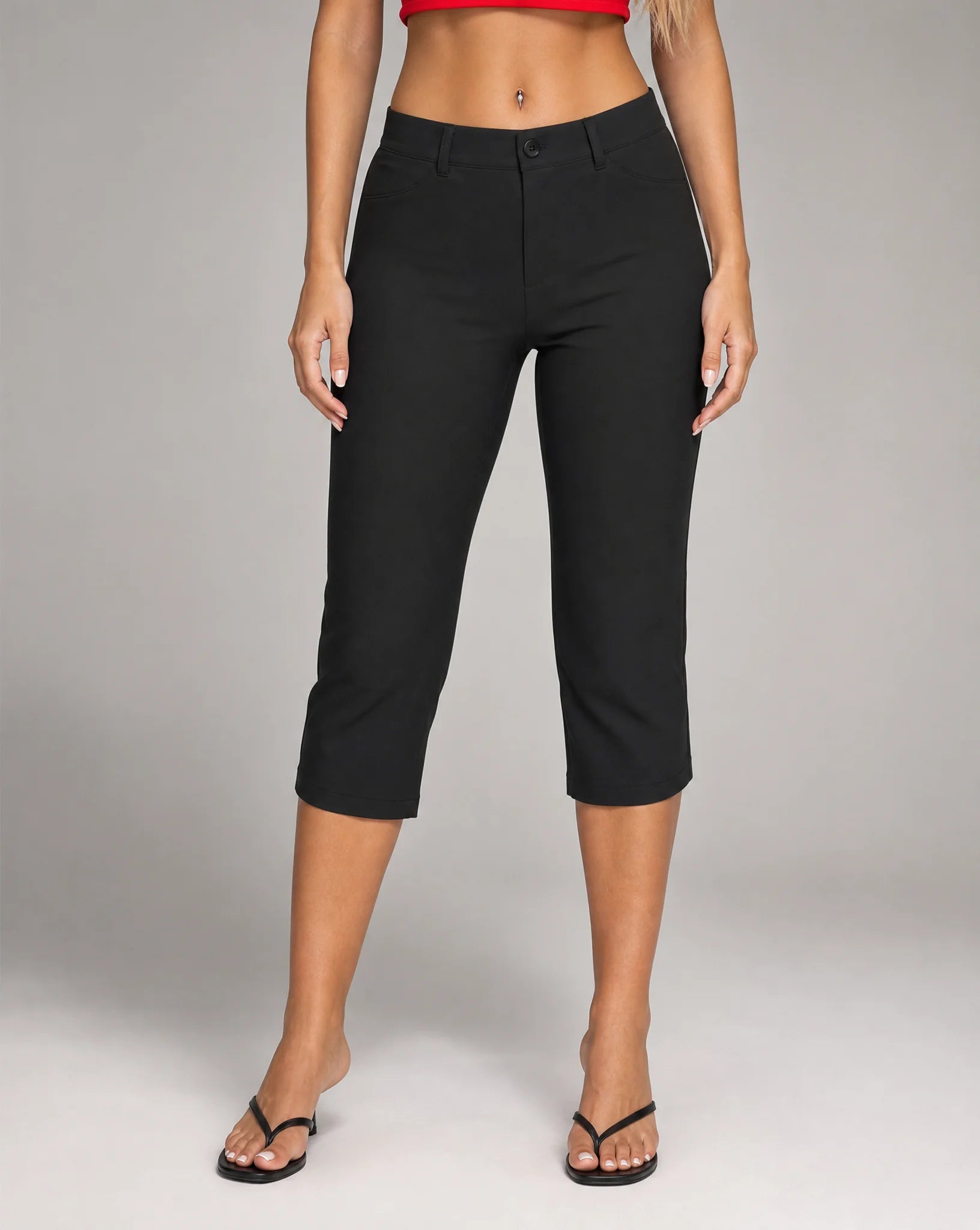 Women's black stretch capri pants with cropped straight leg, mid-rise waist and side pockets by ILYNORA