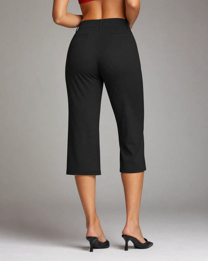 Women's black stretch capri trousers with comfortable slim fit, cropped length and back view by ILYNORA