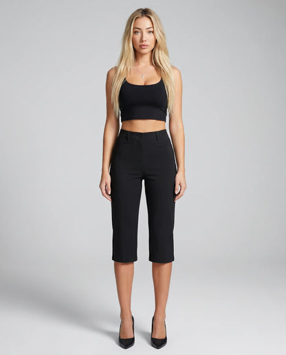 Women's black stretch capri trousers with pockets, cropped slim fit and tailored silhouette by ILYNORA