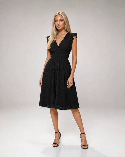 Women's black broderie anglaise midi dress with elegant embroidery and refined styling by ILYNORA