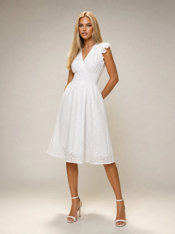 Women's white broderie anglaise midi dress with flutter sleeves and elegant summer styling by ILYNORA