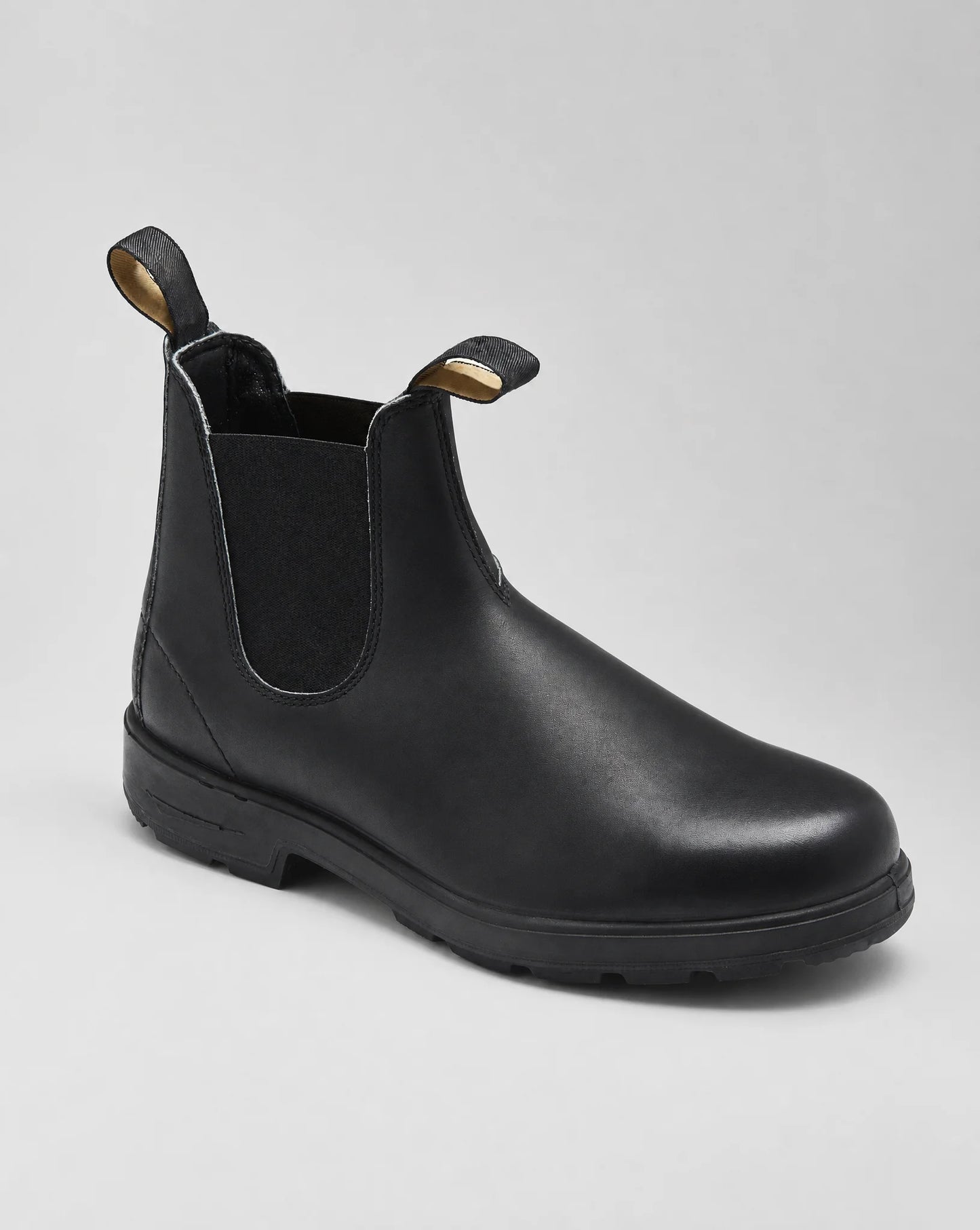 Black Chelsea boots with elastic side panels, pull tabs and durable sole for everyday wear by ILYNORA