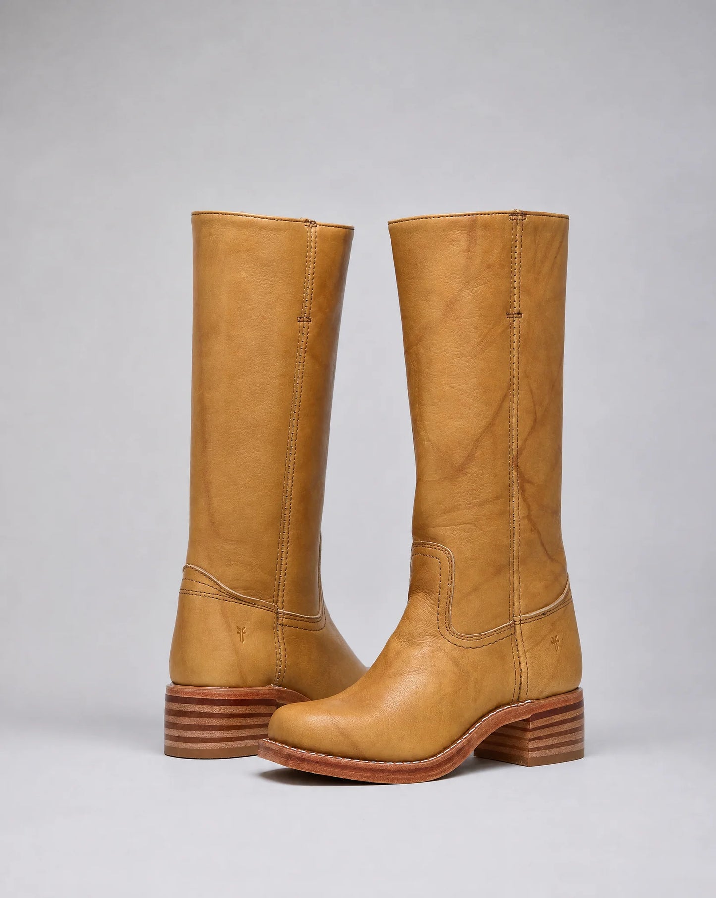 Women's beige knee-high leather boots with classic cowboy styling and refined everyday look by ILYNORA