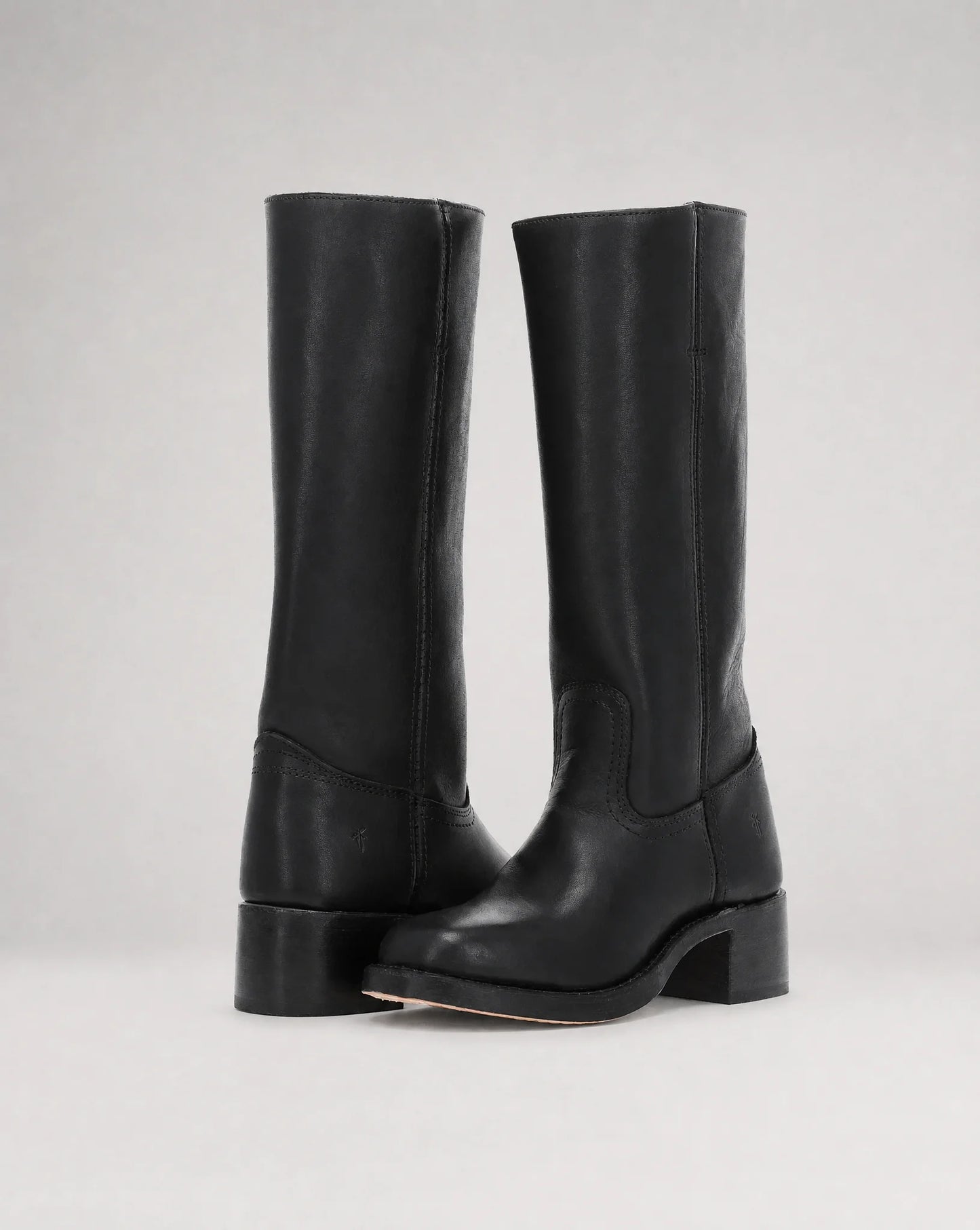 Women's black cowboy style leather boots with sleek knee-high profile and modern western appeal by ILYNORA