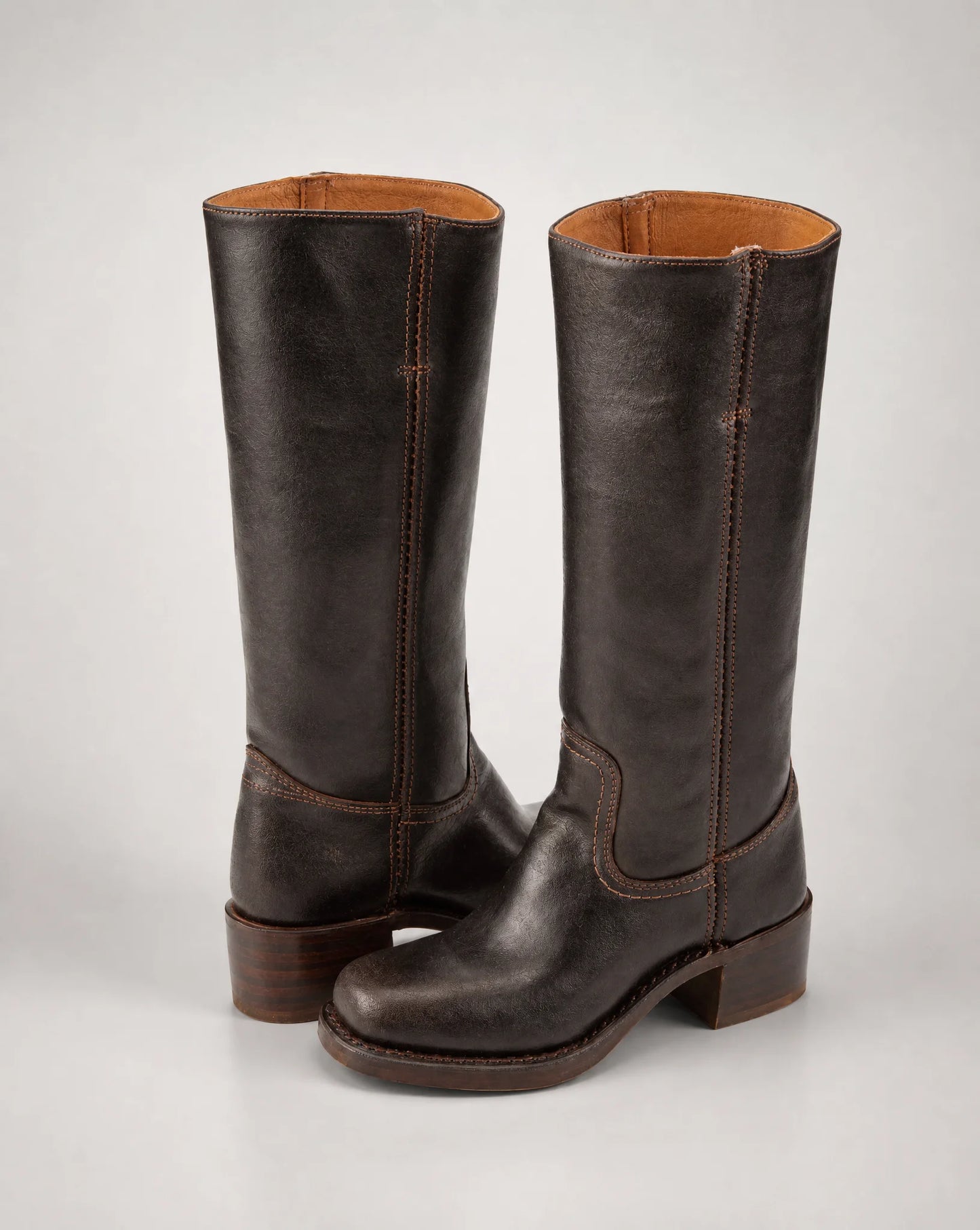 Women's dark brown cowboy style leather boots with knee-high shaft and classic western design by ILYNORA
