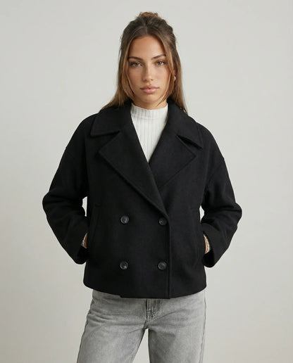 Women's cropped double-breasted jacket in black by Ilynora, front view with structured fit and modern silhouette