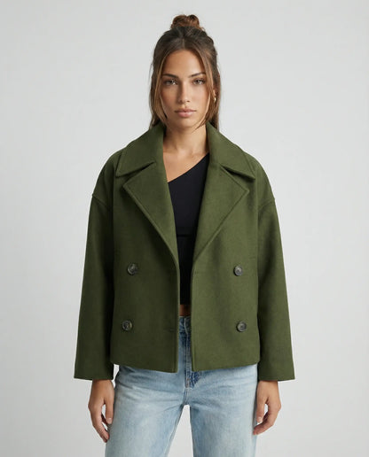 Green cropped double-breasted jacket by Ilynora, front view with tailored fit and clean design