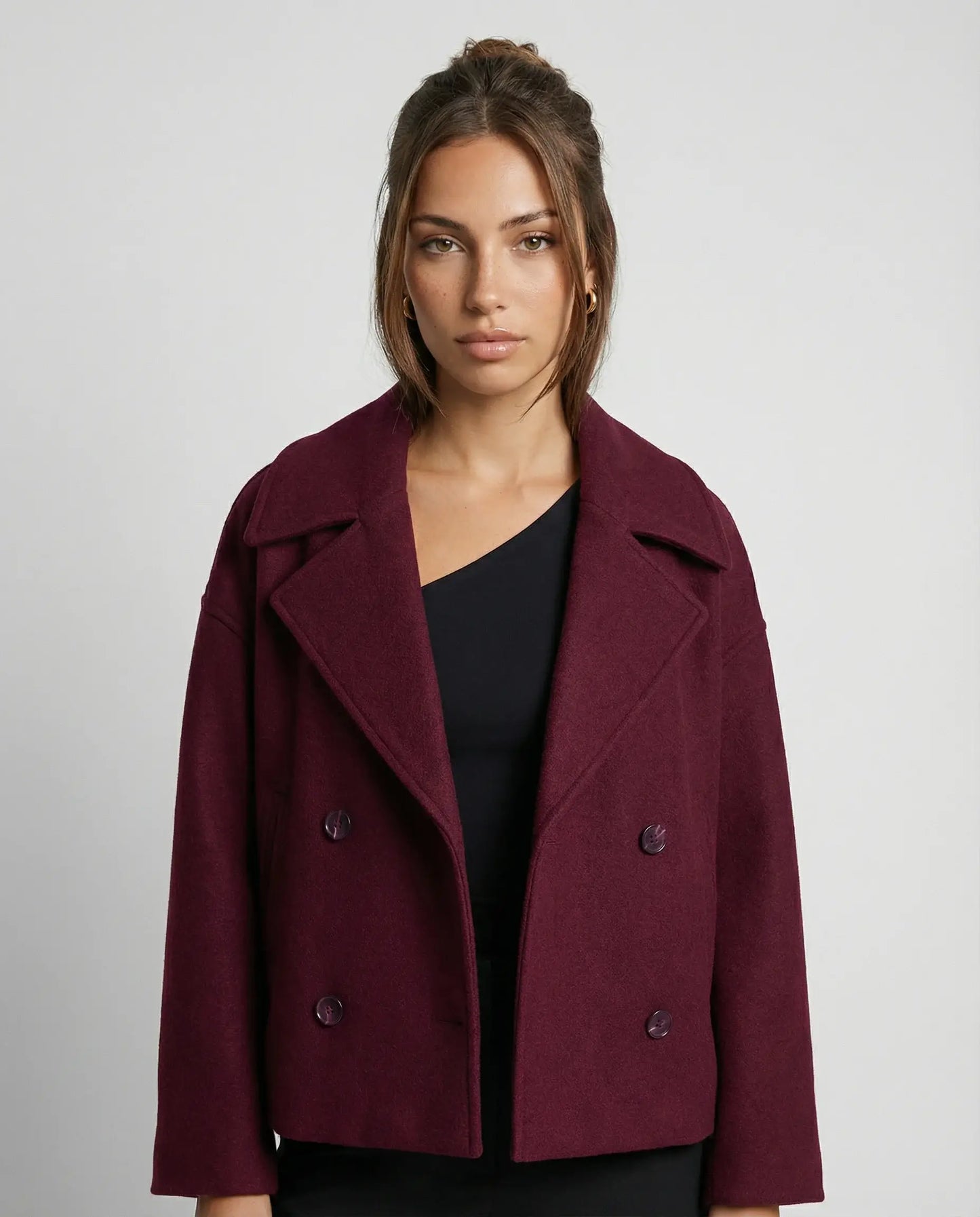 Red cropped double-breasted jacket by Ilynora, front view with structured fit and bold modern look