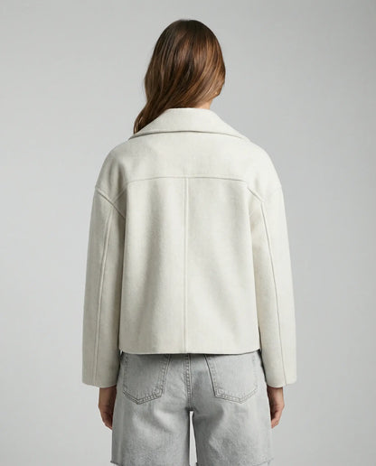White cropped double-breasted jacket by Ilynora, back view showing clean lines and tailored design