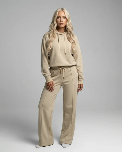 Beige cropped hoodie and wide leg tracksuit by Ilynora, full body view with relaxed style and clean silhouette