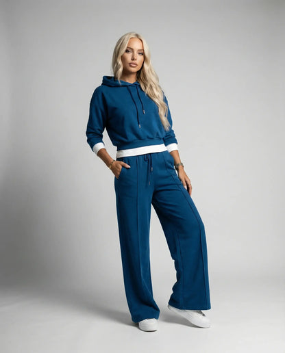 Blue cropped hoodie and wide leg tracksuit by Ilynora, full body view with relaxed silhouette and modern fit